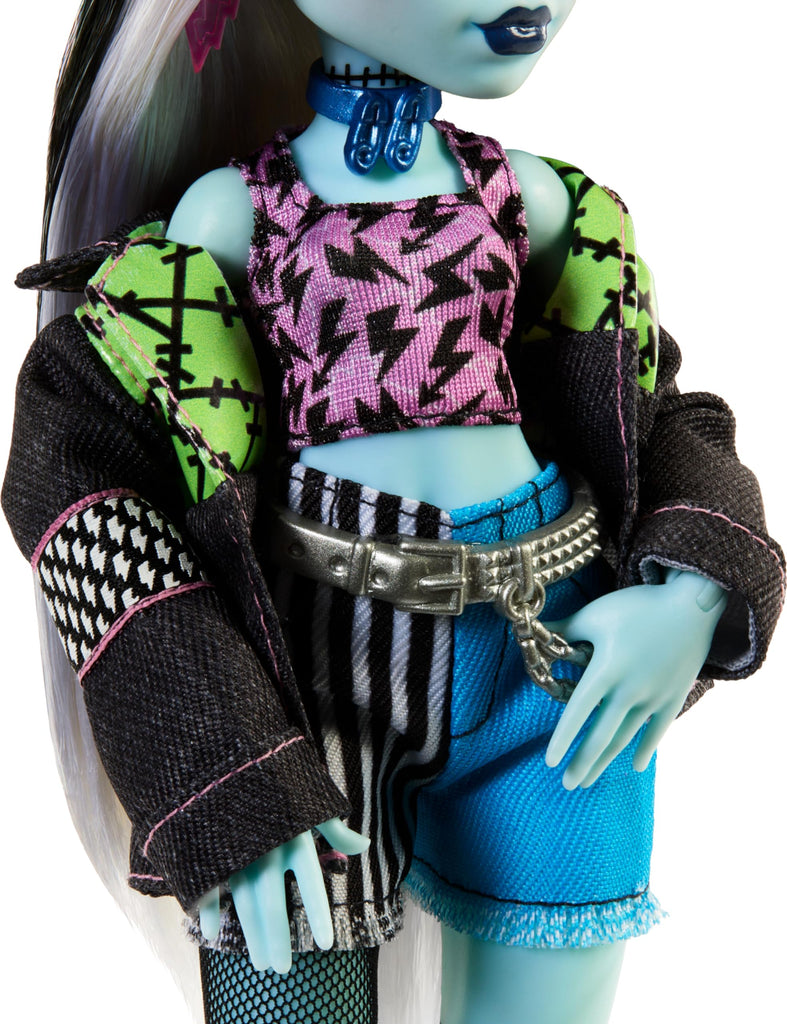 Monster High Frankie Stein Doll in Denim Jacket and Shorts, Includes Pet Dog Watzie and Accessories Like a Backpack, Snack and Notebook